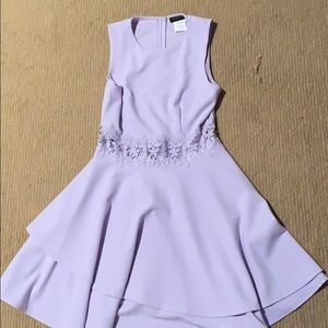 Purple strapless dress with visible midriff